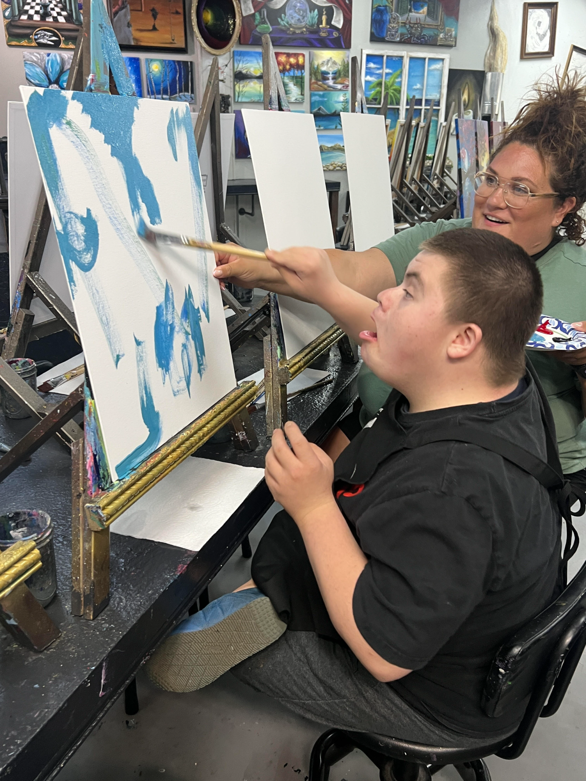 FitAble participant painting during an inclusive art class